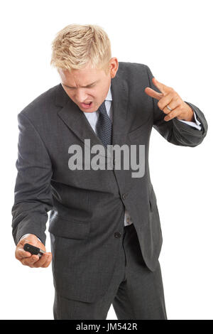 Angry Young Adult Man in tuta urlando al telefono cellulare isolato su sfondo bianco modello di rilascio: Sì. Proprietà di rilascio: No. Foto Stock