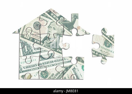 Dollar house puzzle su uno sfondo bianco Foto Stock