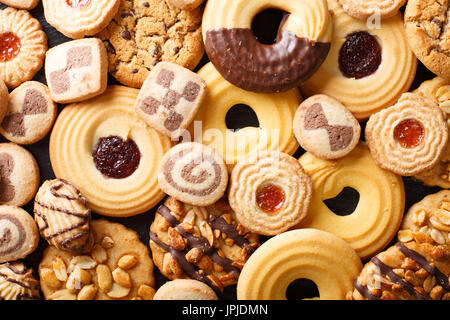 Sullo sfondo di un cookie assortimento di close-up. Vista orizzontale dal di sopra Foto Stock