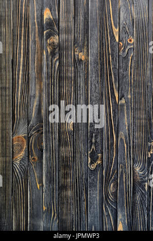 Legno scuro dello sfondo. Pannello di legno verticali schede invecchiato Foto Stock