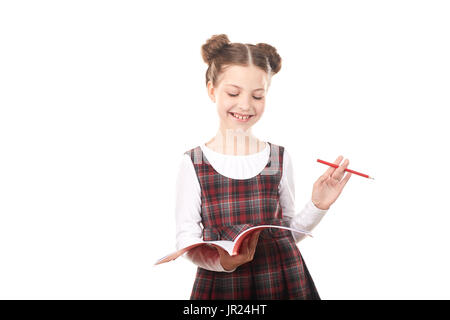 Studente elementare godendo la lettura Foto Stock