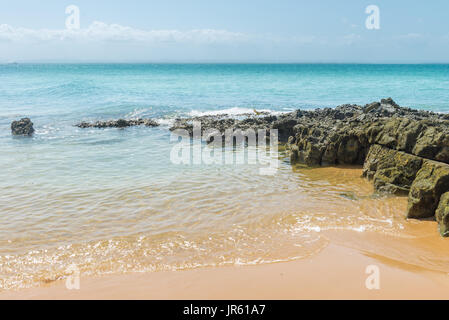 Spiaggia di texture di superficie sabbiosa con ondulazioni formate dal vento Foto Stock