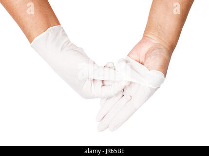 Mano a buttare via il bianco guanti monouso medicali, isolati su sfondo bianco, salva percorso di clipping. Controllo delle infezioni del concetto. Foto Stock