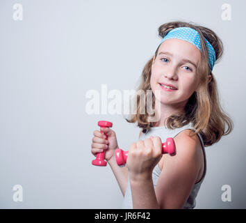 Ragazza con manubri Foto Stock