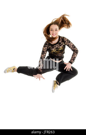 Piuttosto Teenage Hip Hop Dancer salti in aria Foto Stock