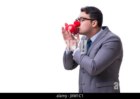 Funny clown imprenditore con un salvadanaio isolati su sfondo bianco Foto Stock