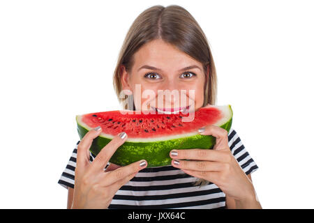 Immagine di un affamato giovane donna di mangiare una grande fetta di anguria delizioso su sfondo isolato Foto Stock