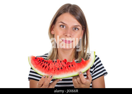 Immagine di un affamato giovane donna di mangiare una grande fetta di anguria delizioso su sfondo isolato Foto Stock