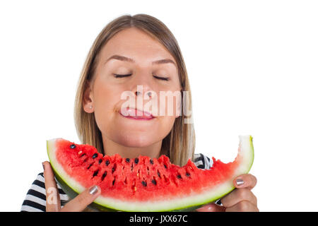 Immagine di un affamato giovane donna di mangiare una grande fetta di anguria delizioso su sfondo isolato Foto Stock
