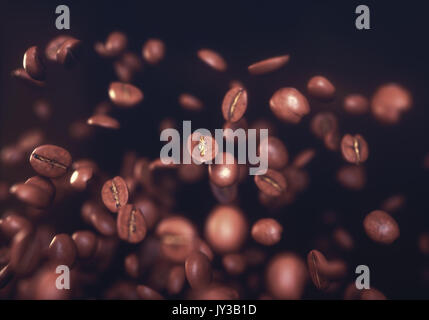 Caffè torrefatto in grani, congelati grano in aria con bassa profondità di campo. Foto Stock