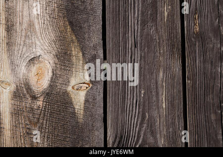 Texture, grande buio di tavole di legno con macchie di luce disposti verticalmente. La foto in orizzontale, sfondo Foto Stock