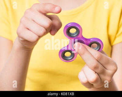 Mano con spinner Foto Stock