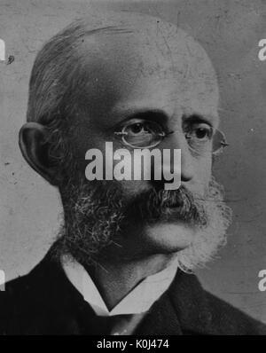 Colpo alla testa di originale membro della facoltà del Johns Hopkins University Medicina, Henry Mills Hurd, indossando un abito scuro e una camicia bianca con cornice circolare occhiali, con una grave l'espressione del viso. 1901. Foto Stock