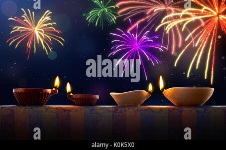 Diwali celebrazione con diya lampade e fuochi d'artificio Foto Stock