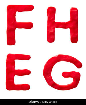 Red plastilina lettere F H e G isolato su uno sfondo bianco Foto Stock