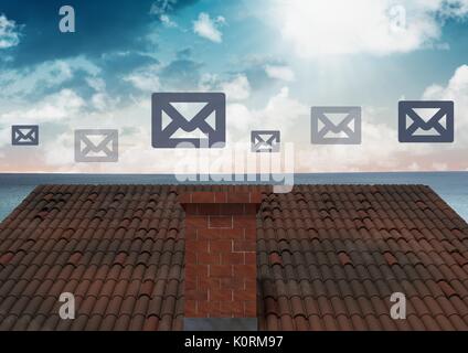 Composito digitale delle icone di posta elettronica su tetti Foto Stock