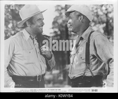 Wayne Morris e Preston Foster in tute e cappelli da cowboy in un film ancora più tenace provengono, 1935. Credito Foto Collezione Smith/Gado/Getty Images. Foto Stock