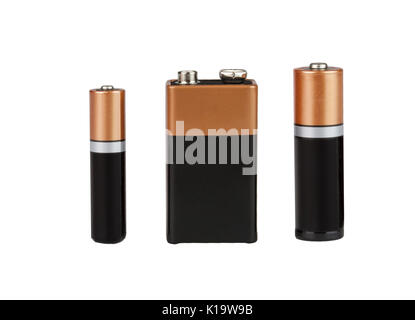 Tre diverse batterie di tipo AAA, tipo AA, tipo PP3, su uno sfondo bianco, isolato Foto Stock