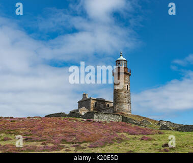 Faro superiore torre sul polpaccio dell uomo Foto Stock