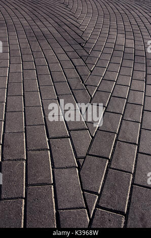 Sfondo di ciottoli blocco di cemento pietre strada facendo astratto del segno di freccia Foto Stock