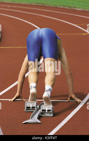 Sprinter al blocco di partenza poco prima della gara Foto Stock