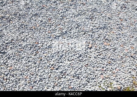 Grigio graniglia di poco le pietre come rivestimento di pavimento Foto Stock