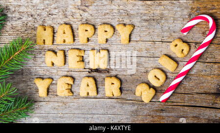 Felice anno nuovo nota scritta con le lettere dei cookie Foto Stock