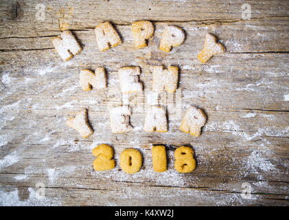 Felice anno nuovo nota scritta con le lettere dei cookie Foto Stock