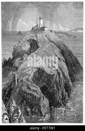 1870: il Sud pila faro fu costruito sulla sommità di una piccola isola a nord-ovest della costa di Isola Santa, Anglesey, Galles. Fu costruita nel 1809 per avvertire le navi delle rocce pericolose di seguito. Foto Stock