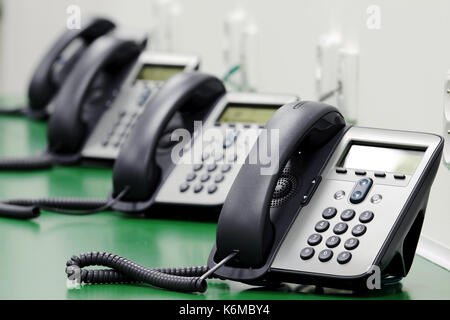Telefoni in call centrum Foto Stock