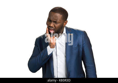 Afro American businessman sensazione Dente dolore. Foto Stock