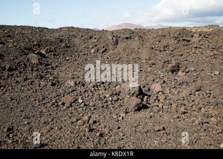 Malpais badlands paesaggio vulcanico Parque Natural Los Volcanes, Yaiza, Lanzarote, Isole canarie, Spagna Foto Stock