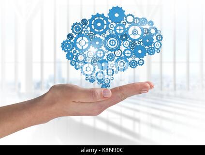 Composito Digitale della mano aperta con ingranaggi cog Foto Stock