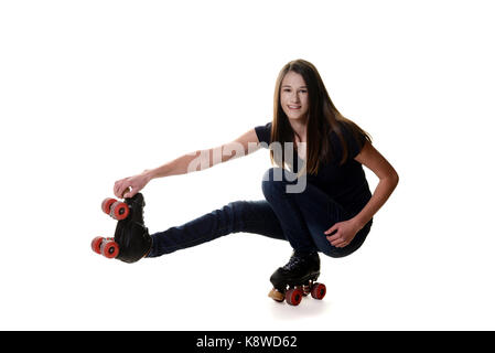 Teen girl facendo girare il rullo di anatra skate spostare Foto Stock