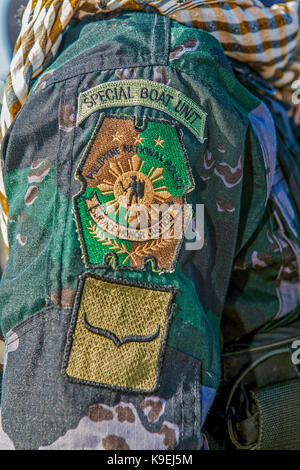 Patch di spallamento del Philippine National Police speciale unità di barca, SBU, indossato da un poliziotto in Puerto Princesa, isola di Palawan nelle Filippine. Foto Stock
