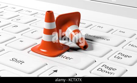 Orange traffico coni su bianco tastiera portatile Foto Stock