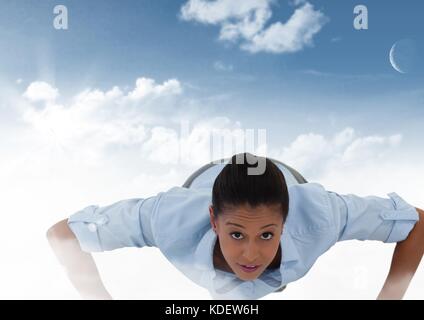 Digital composito di imprenditrice in nubi Foto Stock