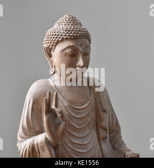 A mano in legno intagliato buddha realizzato in Laos il sud est asiatico Foto Stock