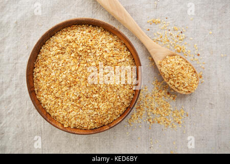 Il germe di grano in ciotola sfondo dalla vista superiore Foto Stock