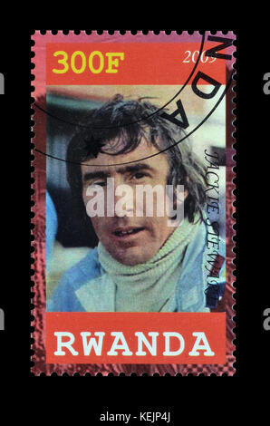 Francobollo cancellato stampato dal Ruanda, che mostra Jackie Stewart. Foto Stock