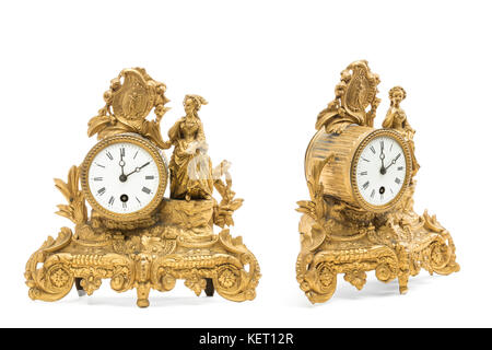 Antiquariato color oro Orologi da tavolo sullo sfondo bianco. Foto Stock