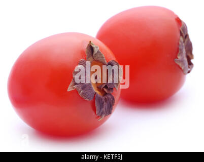 Fresche cachi maturi su sfondo bianco Foto Stock