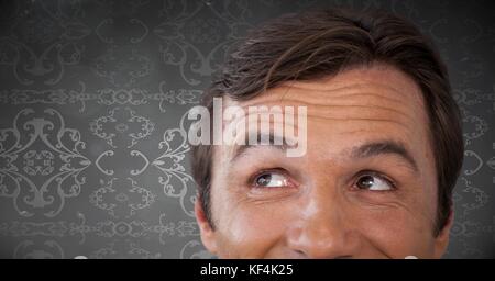 Composito Digitale dell uomo che guarda verso l'alto con uno sfondo background pattern Foto Stock