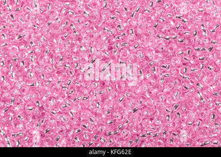 Sfondo di colore rosa perline di vetro. Foto Stock
