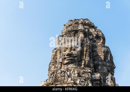 Sorriso in pietra faccia a tempio Bayon in Angkor Thom siem reap Cambogia Foto Stock