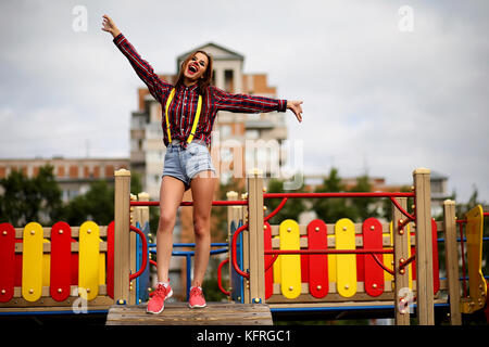 Carino ragazza in un clown trucco Foto Stock