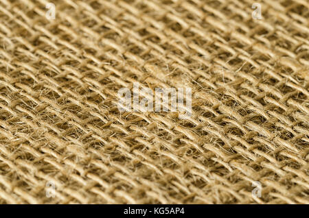 Il tessuto di iuta strati vista diagonale. coarse brown fili tessuti per tessile ruvida, utilizzato per sacchetti. Chiamato anche materie o golden fibra. foto. Foto Stock