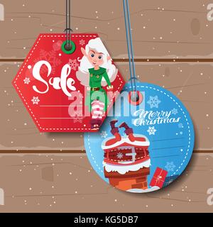Due tag di natale il concetto di vendita colorati segni di sconto su sfondo di legno Illustrazione Vettoriale