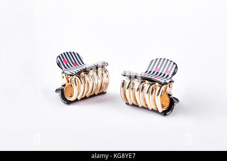 Capelli belli fermi su sfondo bianco. Foto Stock