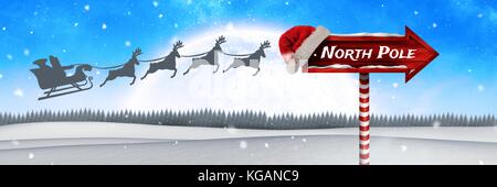 Composito Digitale del Polo Nord il testo su indicazioni del cartello in legno in Natale paesaggio invernale e Babbo Natale con la slitta e la renna Foto Stock